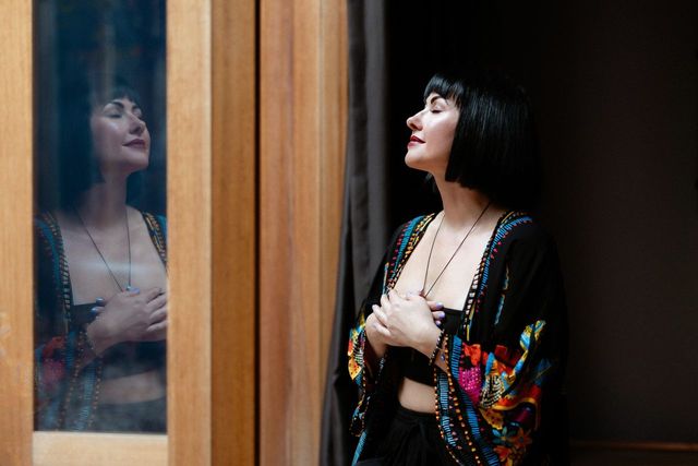 Kasia by the timber window at Vitality House
